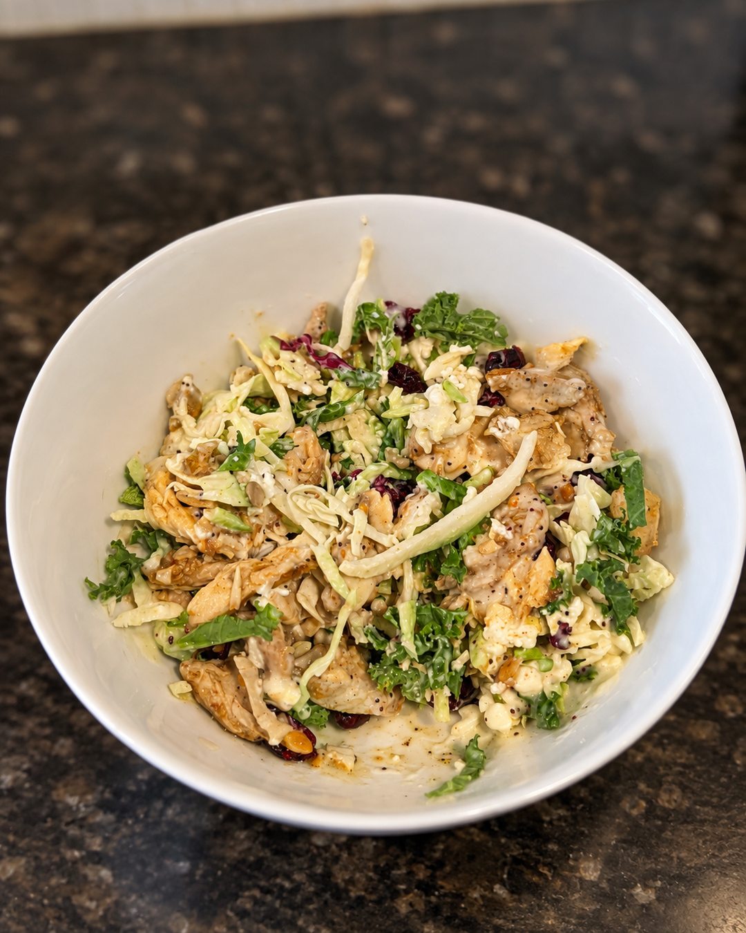 Taylor Farms Sweet Kale chopped salad topped with prepackaged chicken shawarma, alternate angle.