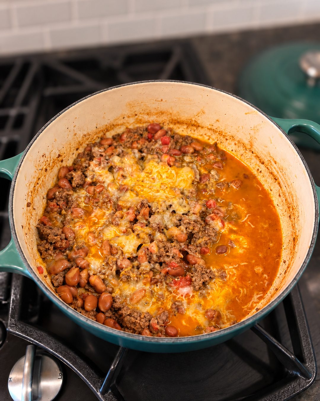 Finished ground-beef version of the Easy Protein Bowl in the pan with melted shredded cheese.